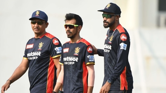 (L-R) RCB batting coach Sanjay Bangar, leg-spinner Yuzvendra Chahal and pacer Mohammed Siraj during the first training session ahead of IPL 2021(RCB)