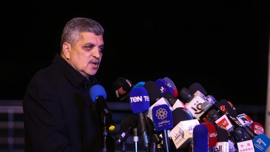 Admiral Osama Rabie, head of SCA, speaks to the media during a news conference following the freeing of the Ever Given container ship, in Ismailia, on March 29. Rabie said it could take from two-and-a-half to three days to clear the backlog on Suez canal, and a canal source said more than 100 ships would be able to enter the channel daily, Reuters reported.(Islam Safwat / Bloomberg)