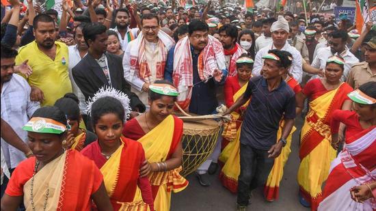 Congress candidate from the Nagaon Sadar constituency, Santanu Sarmah, with senior party leader Rokibul Hussain during an election rally for the assembly polls in Nagaon district of Assam on Tuesday. (PTI PHOTO.)