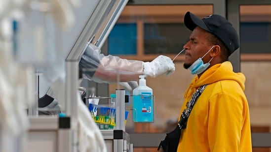 A medic collects a swab sample from a traveller at a booth at the COVID-19 coronavirus rapid testing centre in Israel's Ben-Gurion Airport in Lod, near Tel Aviv, on January 19, 2021. (Representational) (AFP) A medic collects a swab sample from a traveller at a booth at the COVID-19 coronavirus rapid testing centre in Israel's Ben-Gurion Airport in Lod, near Tel Aviv, on January 19, 2021. (Representational) (AFP)
