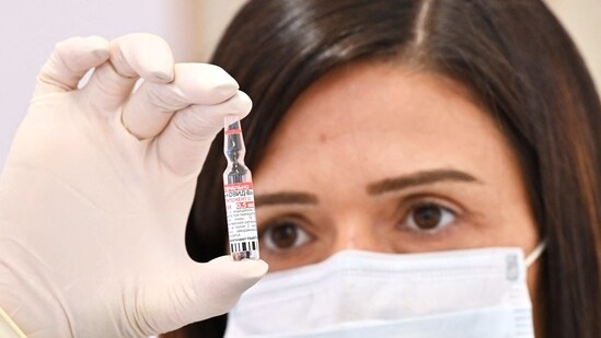 A medical worker holds a vial of the Russian Sputnik V Covid-19 vaccine. (AFP)
