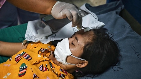 An injured Myanmar refugee receives medical attention at Sop Moei Hospital in Mae Hong Son province on March 30, 2021, after crossing into Thailand via the Salween river following air strikes in Myanmar's Karen state. (Photo by Lillian SUWANRUMPHA / AFP) (AFP) An injured Myanmar refugee receives medical attention at Sop Moei Hospital in Mae Hong Son province on March 30, 2021, after crossing into Thailand via the Salween river following air strikes in Myanmar's Karen state. (Photo by Lillian SUWANRUMPHA / AFP) (AFP)