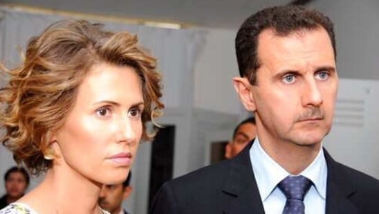 FILE - In this July, 13, 2010 file photo, Syrian President Bashar Assad, left, and his wife Asma Assad, listen to explanations as they visit a technology plant in Tunis, Tunisia. Assad’s office said Wednesday, March 17, 2021, the country's first couple are on their way to recovery nine days after they tested positive for coronavirus. The presidency said that Assad and his wife have had mild symptoms of the illness and are continuing their work as usual from home and will return to normal life once they test negative to COVID-19 (AP Photo/Hassene Dridi, File)(AP)