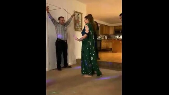 The image shows a woman dancing to the song from Sholay.(Twitter@Sheri_happy)