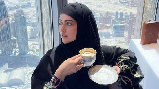 Sana Khan enjoying gold-plated coffee at Burj Khalifa. 