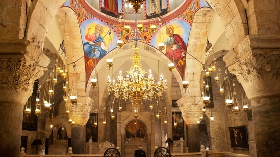 Father Samuel Aghoyan, the Armenian superior at the Church of the Holy Sepulchre looks up as he stands at the Saint Helena chapel inside the church which is revered in Christian tradition as the site of Jesus' crucifixion and burial, during his interview with Reuters, in Jerusalem's Old City February 24, 2021. (REUTERS)