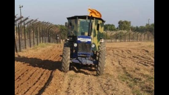 Bulletproof tractors are being used to till the land . (HT Photo) Bulletproof tractors are being used to till the land . (HT Photo)