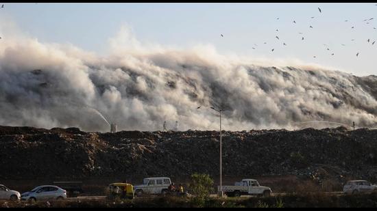Smoke billowing from the dumping ground at Dadumajra on Wednesday. (Ravi Kumar/HT) Smoke billowing from the dumping ground at Dadumajra on Wednesday. (Ravi Kumar/HT)
