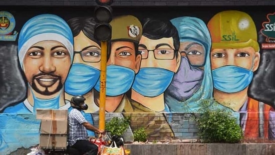 A motorist passes by a mural of frontline workers against coronavirus at RK Puram in New Delhi. (Sanchit Khanna/HT file photo) A motorist passes by a mural of frontline workers against coronavirus at RK Puram in New Delhi. (Sanchit Khanna/HT file photo)