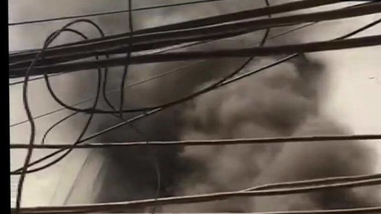 Smoke bellows out of the garment factory (ANI Twitter)
