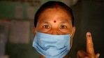 An Indian voter wearing face mask shows the indelible ink mark on her finger after casting her vote during the second phase of elections for Assam state, in Morigaon district, India, Thursday, April 1, 2021. (AP Photo/Anupam Nath)(AP) An Indian voter wearing face mask shows the indelible ink mark on her finger after casting her vote during the second phase of elections for Assam state, in Morigaon district, India, Thursday, April 1, 2021. (AP Photo/Anupam Nath)(AP)