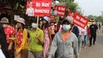 Protesters marching ahead holding signs with portraits of detained Myanmar civilian leader Aung San Suu Kyi during a demonstration against the military coup in Launglon township in Dawei.(AFP Photo) Protesters marching ahead holding signs with portraits of detained Myanmar civilian leader Aung San Suu Kyi during a demonstration against the military coup in Launglon township in Dawei.(AFP Photo)