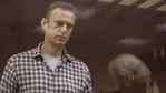 Kremlin critic Alexei Navalny, who is accused of slandering a Russian World War Two veteran, stands inside a defendant dock during a court hearing in Moscow, Russia. (Reuters) Kremlin critic Alexei Navalny, who is accused of slandering a Russian World War Two veteran, stands inside a defendant dock during a court hearing in Moscow, Russia. (Reuters)