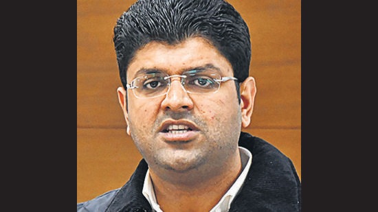 After getting information about Dushyant Chautala’s visit, farmers gathered outside the airport on the outskirts of Hisar, where the state minister’s chopper landed amid heavy security arrangements. (PTI) After getting information about Dushyant Chautala’s visit, farmers gathered outside the airport on the outskirts of Hisar, where the state minister’s chopper landed amid heavy security arrangements. (PTI)