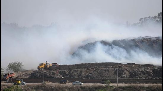 Fire at the garbage dumping ground in Dadumajra continued to smoulder on Thursday. (Ravi Kumar/HT) Fire at the garbage dumping ground in Dadumajra continued to smoulder on Thursday. (Ravi Kumar/HT)