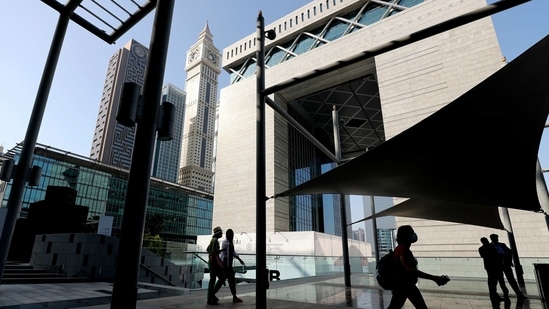People arrive for visiting the 14th edition of Art Dubai at Dubai International Financial Centre, DIFC, which features 50 galleries from 31 countries with a focus on modern and contemporary art, in Dubai, United Arab Emirates, Tuesday, March 30, 2021. (AP)
