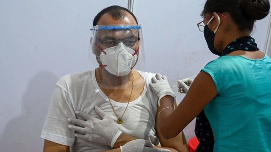 A man gets inoculated with a dose of Covid-19 vaccine, in Mumbai, on April 1. The central government has decided to keep all public and private sector Covid-19 Vaccination Centres (CVCs) operational throughout April, including on gazetted holidays to expand the countrywide anti-coronavirus inoculation drive.(Punit Paranjpe / AFP)