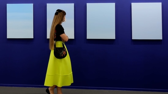 Dubai : A woman visits oil on canvas paintings by Ayesha Sultana of the Experimenter gallery in 14th edition of Art Dubai at Dubai International Financial Centre, DIFC, which features 50 galleries from 31 countries with a focus on modern and contemporary art, in Dubai, United Arab Emirates, Tuesday, March 30, 2021. AP/PTI(AP03_30_2021_000263B)(AP)