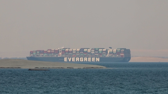 Ever Given, a Panama-flagged cargo ship, is seen in Egypt's Great Bitter Lake Tuesday. (AP Photo ) Ever Given, a Panama-flagged cargo ship, is seen in Egypt's Great Bitter Lake Tuesday. (AP Photo )