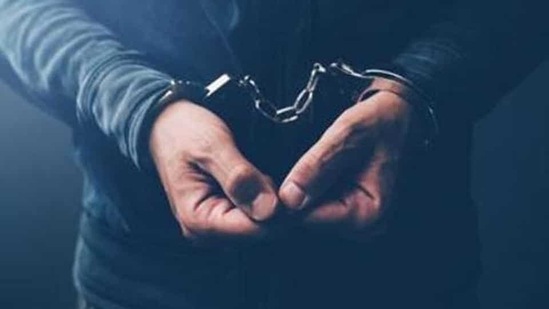 Arrested computer hacker and cyber criminal with handcuffs, close up of hands (Getty Images/ only for representation) Arrested computer hacker and cyber criminal with handcuffs, close up of hands (Getty Images/ only for representation)