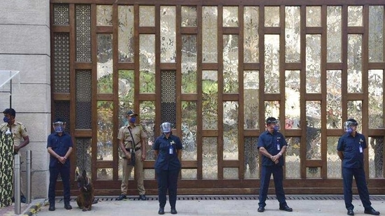 Police personnel stand guard at Mukesh Ambani's residence, a day after explosives were found in an abandoned car in its vicinity, in Mumbai on February 26 (PTI File Photo ) Police personnel stand guard at Mukesh Ambani's residence, a day after explosives were found in an abandoned car in its vicinity, in Mumbai on February 26 (PTI File Photo )