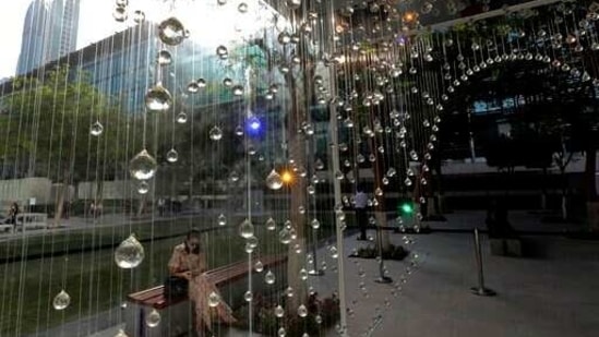 People visit Swiss Fog Magnified of the 14th edition of Art Dubai at Dubai International Financial Centre, DIFC, which features 50 galleries from 31 countries with a focus on modern and contemporary art, in Dubai, United Arab Emirates, Tuesday, March 30, 2021. (AP)