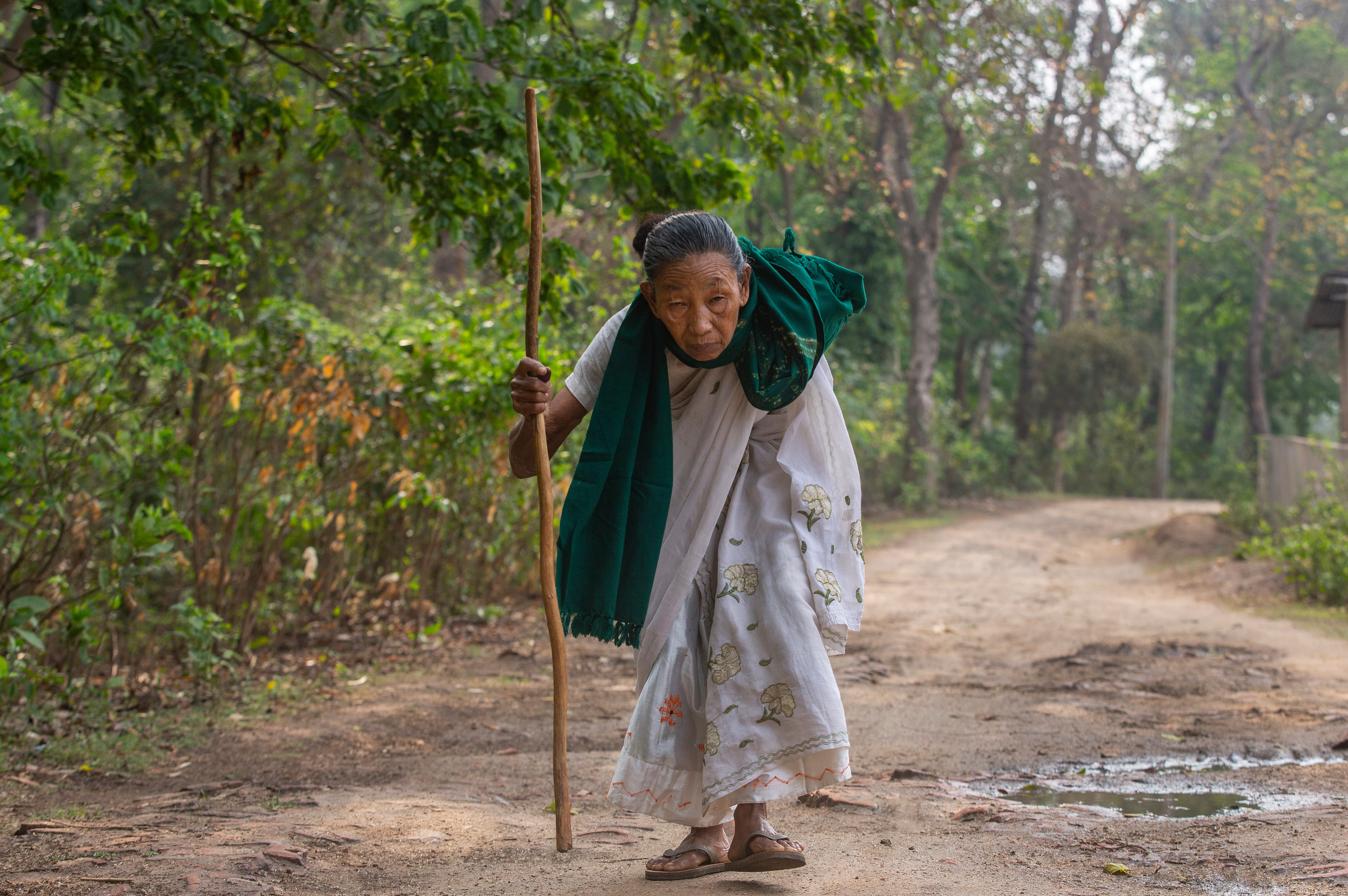 Jyoti Boro, 96, an elderly voter, returns home in Morigaon after casting her vote during the second phase of elections in Assam. (AP) Jyoti Boro, 96, an elderly voter, returns home in Morigaon after casting her vote during the second phase of elections in Assam. (AP)