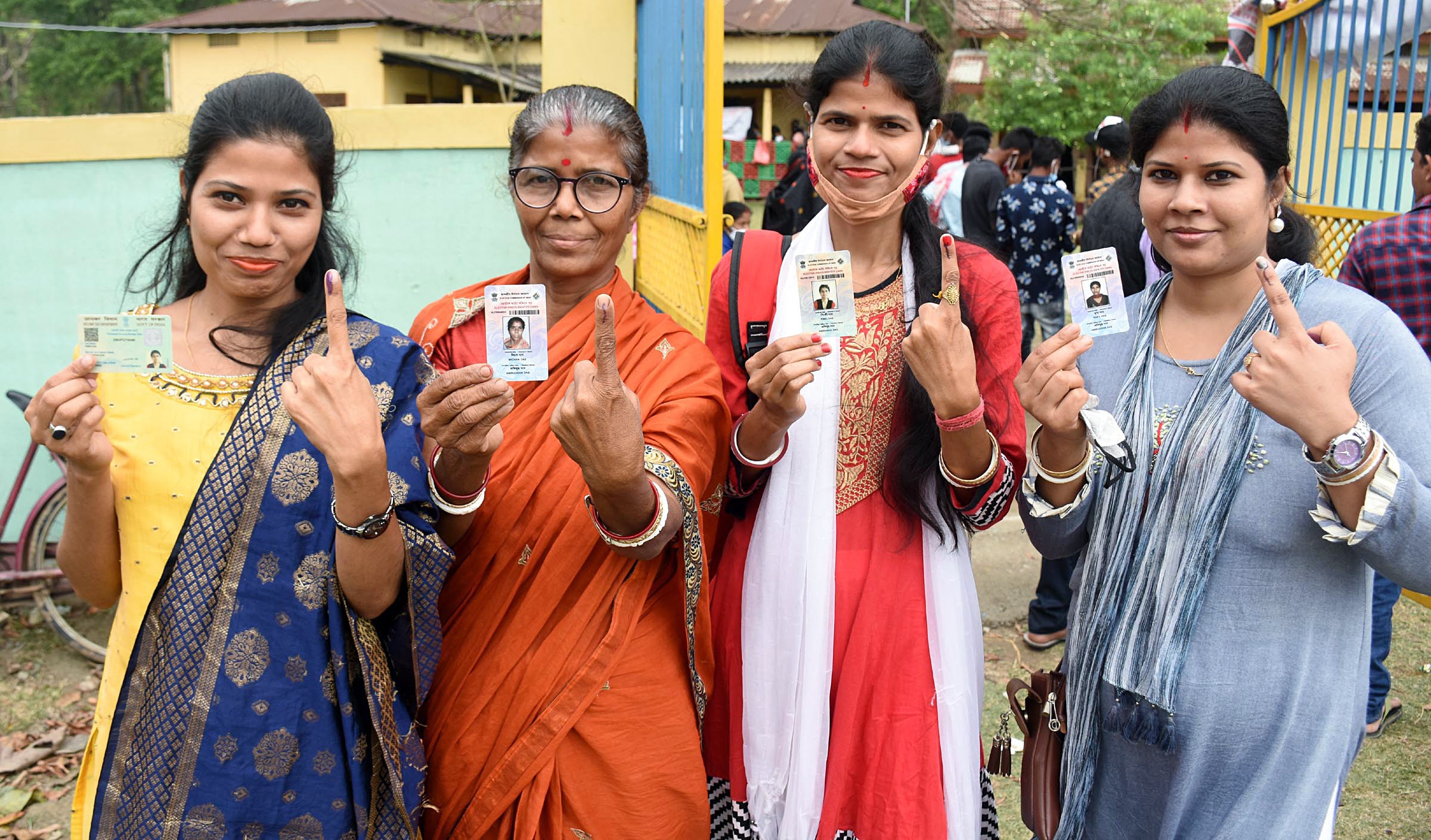 Female voters show their ID cards and fingers marked with indelible ink after casting their votes at a polling station in the second phase of Assam Assembly Elections, at Dhekiabari in Morigaon district on Thursday. (ANI Photo) Female voters show their ID cards and fingers marked with indelible ink after casting their votes at a polling station in the second phase of Assam Assembly Elections, at Dhekiabari in Morigaon district on Thursday. (ANI Photo)