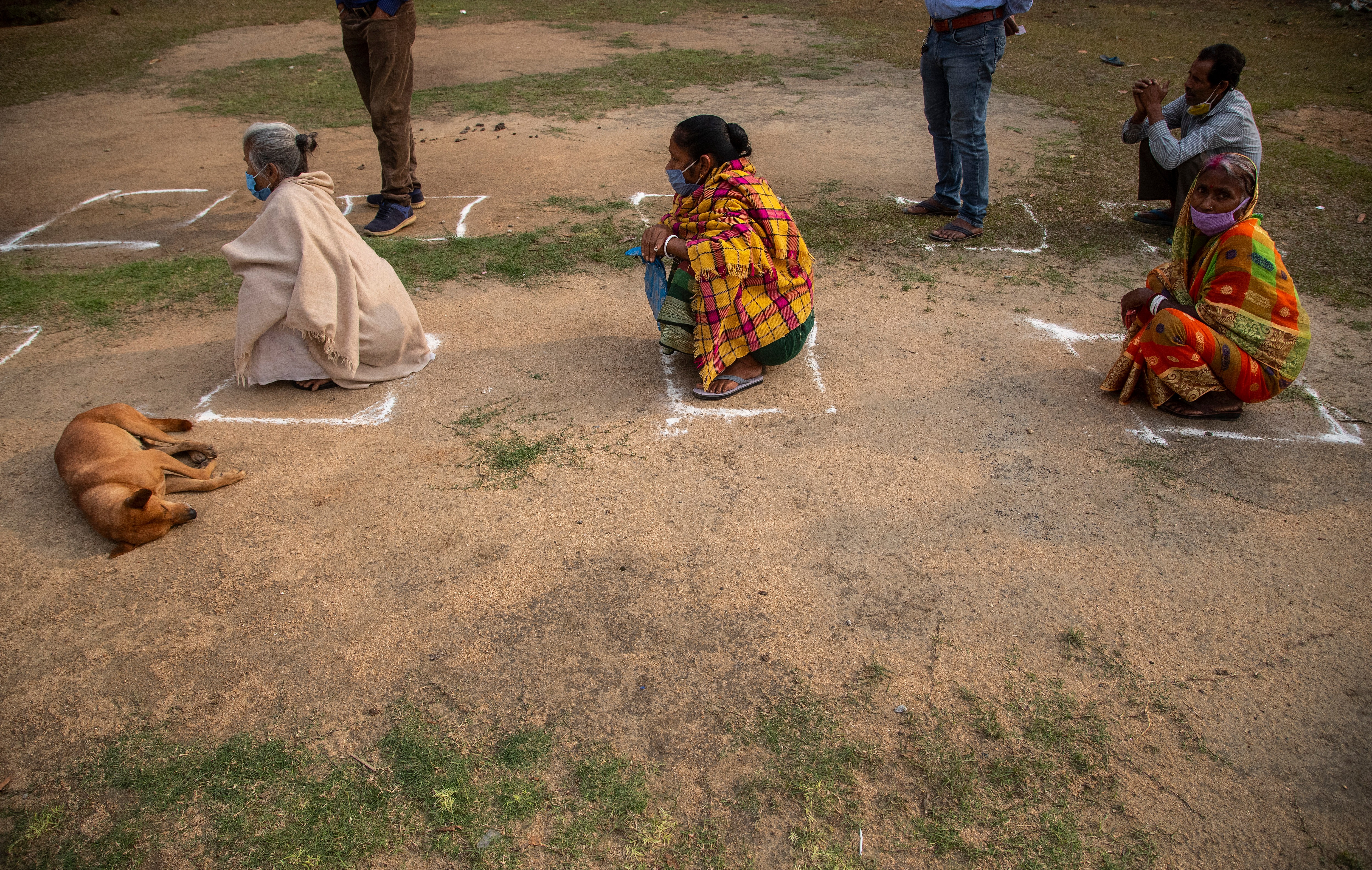 Elderly Indian voters sit in a queue to cast their votes during the second phase of elections for Assam state, in Morigaon district, India, Thursday, April 1, 2021. (AP) Elderly Indian voters sit in a queue to cast their votes during the second phase of elections for Assam state, in Morigaon district, India, Thursday, April 1, 2021. (AP)