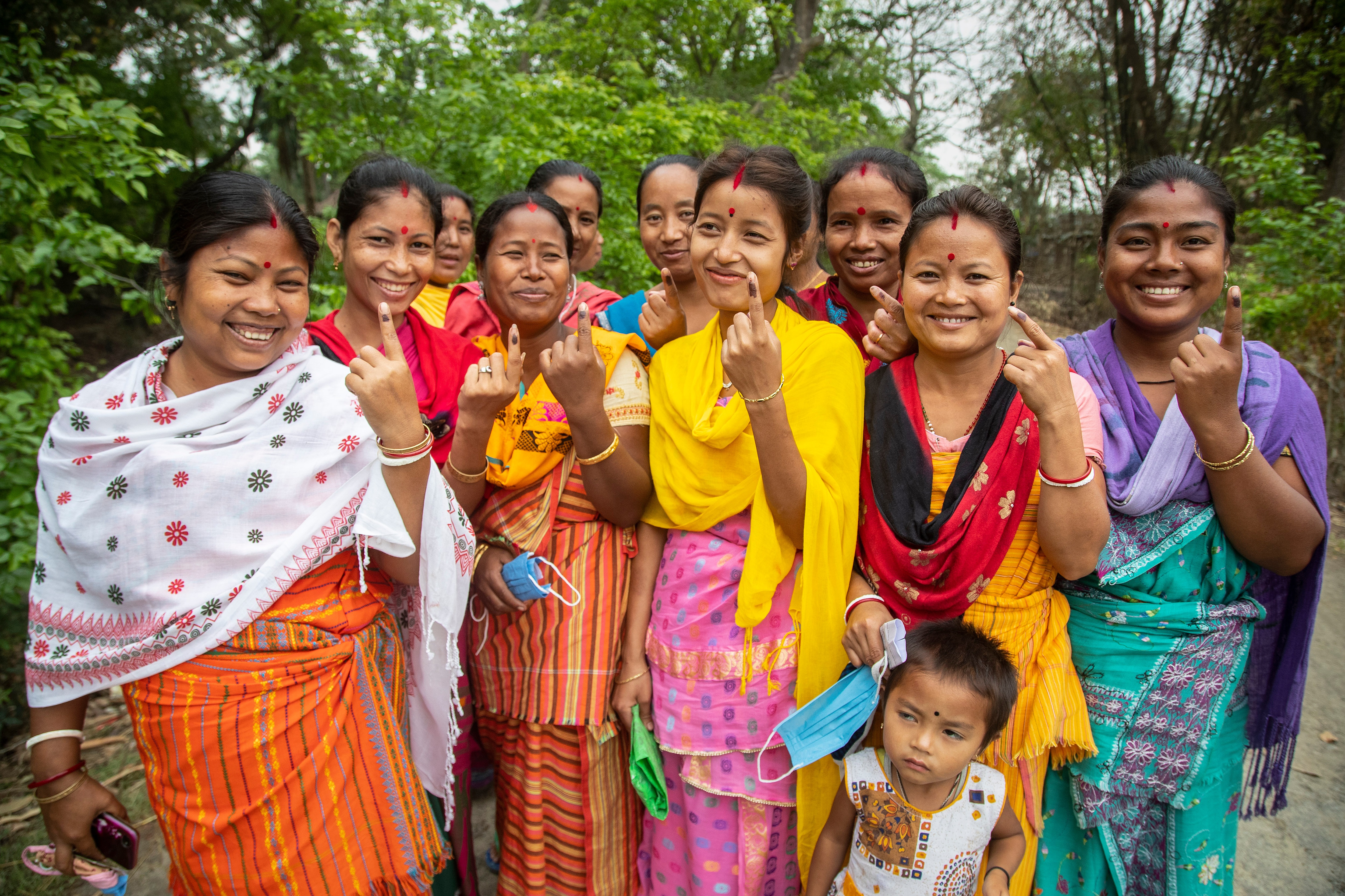 Tribal Bodo voters display the indelible ink mark on their fingers after casting their votes during the second phase of elections in Assam's Morigaon. (AP) Tribal Bodo voters display the indelible ink mark on their fingers after casting their votes during the second phase of elections in Assam's Morigaon. (AP)