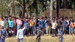 Security personnel stand guard as T TMC supporters raise slogans during a West Bengal CM Mamata Banerjee visits polling booth, in Nandigram on Thursday. (ANI Photo)