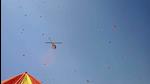 Uttarakhand government helicopter showering flower petals at the religious flag hoisting at Bairagi camp. (HT photo) Uttarakhand government helicopter showering flower petals at the religious flag hoisting at Bairagi camp. (HT photo)