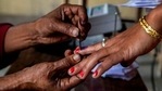 A polling officer applies indelible ink on the finger of a voter during the second phase of elections for Assam state, in Morigaon district on Thursday. (AP Photo ) A polling officer applies indelible ink on the finger of a voter during the second phase of elections for Assam state, in Morigaon district on Thursday. (AP Photo )