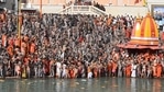 Naga Sadhus (Hindu holy men) gather before taking a holy dip in the waters of the River Ganga. Even as authorities upped their guards in view of the Covid-19 pandemic and mandated devotees to carry a negative RT-PCR certificate, many turned up without it on day-1 of the fest, according to news agency PTI. Naga Sadhus (Hindu holy men) gather before taking a holy dip in the waters of the River Ganga. Even as authorities upped their guards in view of the Covid-19 pandemic and mandated devotees to carry a negative RT-PCR certificate, many turned up without it on day-1 of the fest, according to news agency PTI.