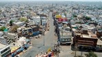 A deserted road during the weekend lockdown in Bhopal.(PTI) A deserted road during the weekend lockdown in Bhopal.(PTI)