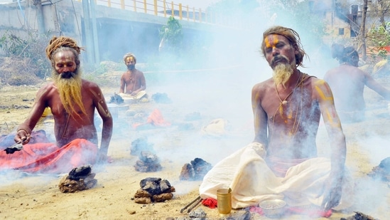 Sadhus or Holy men offering prayer during a Kumbh Mela, in Haridwar on Tuesday. (ANI Photo) Sadhus or Holy men offering prayer during a Kumbh Mela, in Haridwar on Tuesday. (ANI Photo)