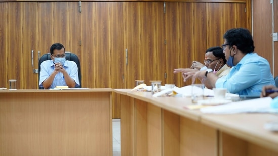 Delhi CM Arvind Kejriwal chairing an emergency meeting in the wake of a rise in Covid-19 cases, at his residence in New Delhi, (HT photo) Delhi CM Arvind Kejriwal chairing an emergency meeting in the wake of a rise in Covid-19 cases, at his residence in New Delhi, (HT photo)