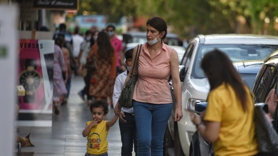 Visitors, some not wearing face masks amid the coronavirus pandemic, at Khan Market, in New Delhi (Photo by Sanchit Khanna / Hindustan Times)