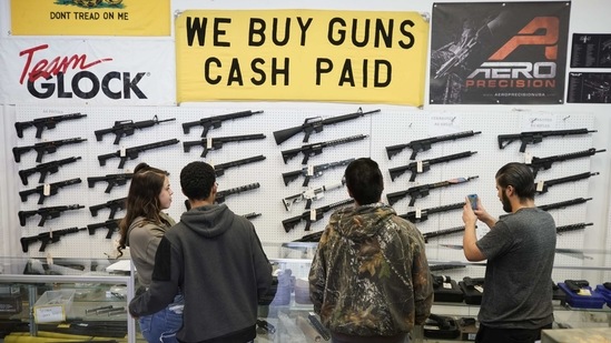 Customers look at AR-15 rifles at a store in Orem, Utah, US. (Bloomberg)