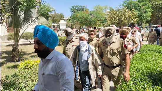 Ex-Punjab DGP Saini, other accused appear in Faridkot court in 2015 police firing cases