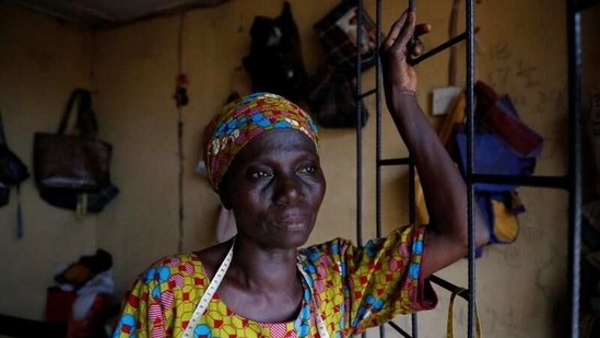 Ajayi in her shop in Ilorin on March 25. She signed up to attend school in the last academic year, only for it to close due to the coronavirus pandemic. But schools reopened in January and Ajayi finally got her chance.(Temilade Adelaja / REUTERS)