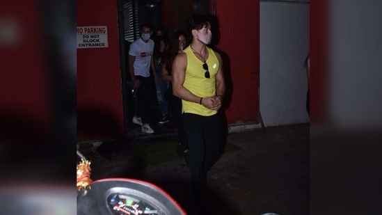 Tiger Shroff was also snapped with Disha and for the night, he opted to wear a lime yellow singlet with a pair of black pyjamas.(Varinder Chawla)