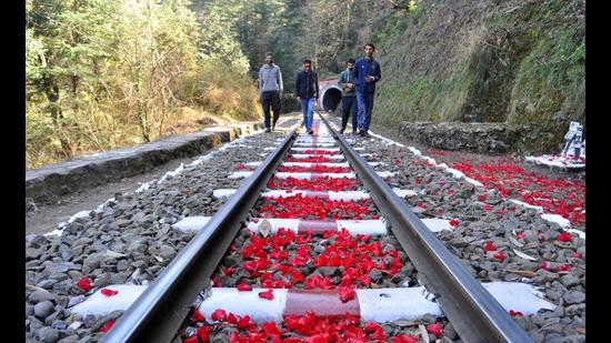 Tourists enjoying a walk down a rail track amid rhododendron petals near Shimla in March. The rhododendrons, the state flower of Himachal Pradesh, are making their presence felt earlier than scheduled due to a warmer winter and sunny spring. (Deepak Sansta/HT) Tourists enjoying a walk down a rail track amid rhododendron petals near Shimla in March. The rhododendrons, the state flower of Himachal Pradesh, are making their presence felt earlier than scheduled due to a warmer winter and sunny spring. (Deepak Sansta/HT)