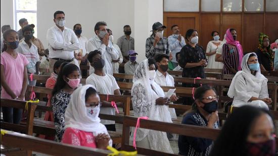 Devotees offering prayers at Christ the King Cathedral in Sector 19, Chandigarh. (Ravi Kumar/HT)