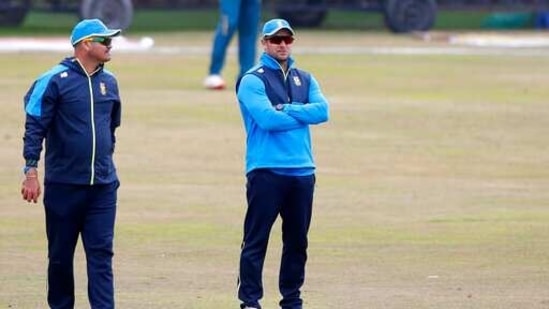 South Africa's head coach Mark Boucher, right, observes players during a practice session at the Pindi Stadium, in Rawalpindi, Pakistan.(AP)