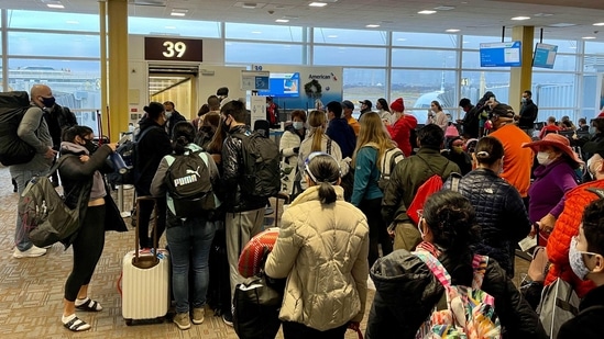 Travellers at Washington Reagan National Airport (DCA) queue at a departure gate in Arlington, Virginia. (AFP)