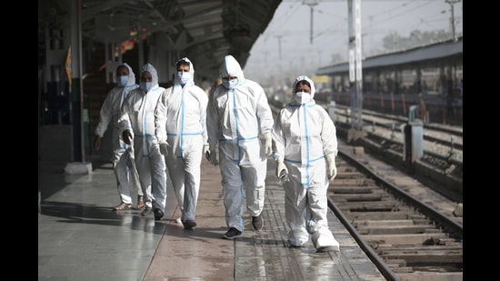 Health workers collect samples from passengers at the Jammu Railway Station on Friday. (PTI) Health workers collect samples from passengers at the Jammu Railway Station on Friday. (PTI)