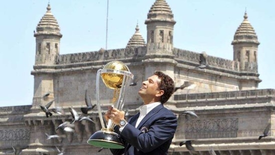 Sachin Tendulkar poses with the trophy after winning the Cricket World Cup final match between Sri Lanka and India in 2011.(AP)