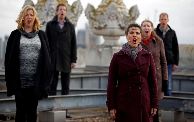 The choir of London's Royal Opera House perform on the rooftop of the Royal Opera House. (REUTERS)
