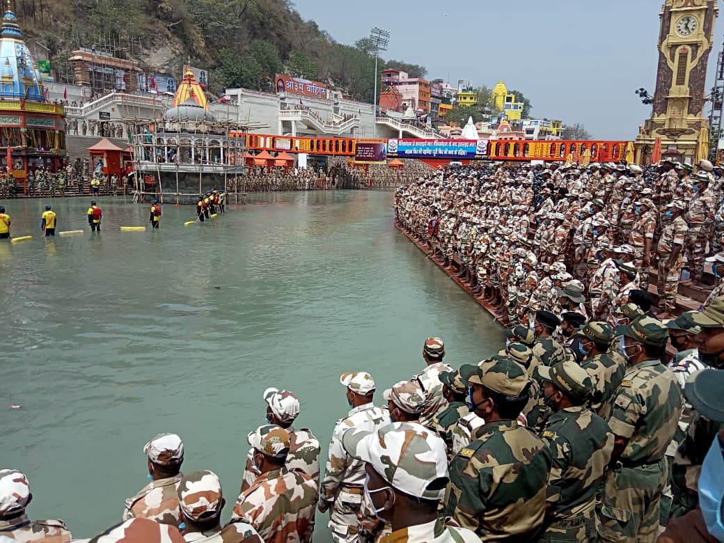 Paramilitary personnel offer prayers for a safe and unhindered Kumbh fair amid rising cases of coronavirus disease (Covid-19) at Har ki Pauri in Haridwar. As many as 12,000 police and 400 paramilitary force personnel have been deployed at the site to maintain law and order and ensure that devotees adhere to Covid-19 norms. Paramilitary personnel offer prayers for a safe and unhindered Kumbh fair amid rising cases of coronavirus disease (Covid-19) at Har ki Pauri in Haridwar. As many as 12,000 police and 400 paramilitary force personnel have been deployed at the site to maintain law and order and ensure that devotees adhere to Covid-19 norms.